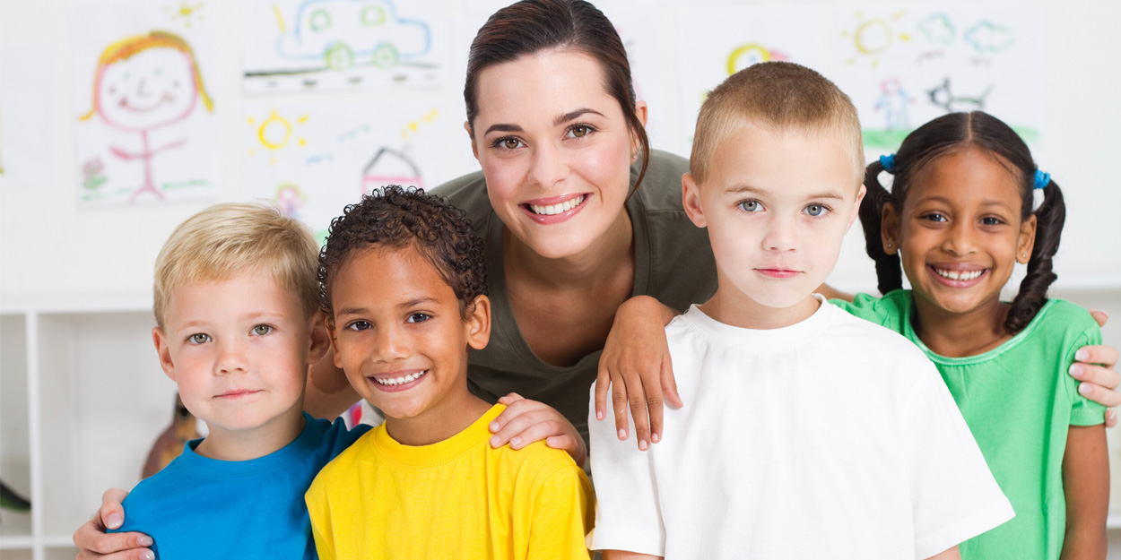 A teacher with a diverse group of students