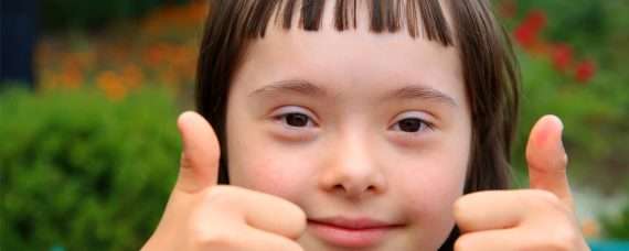 A school girl showing her thumbs up